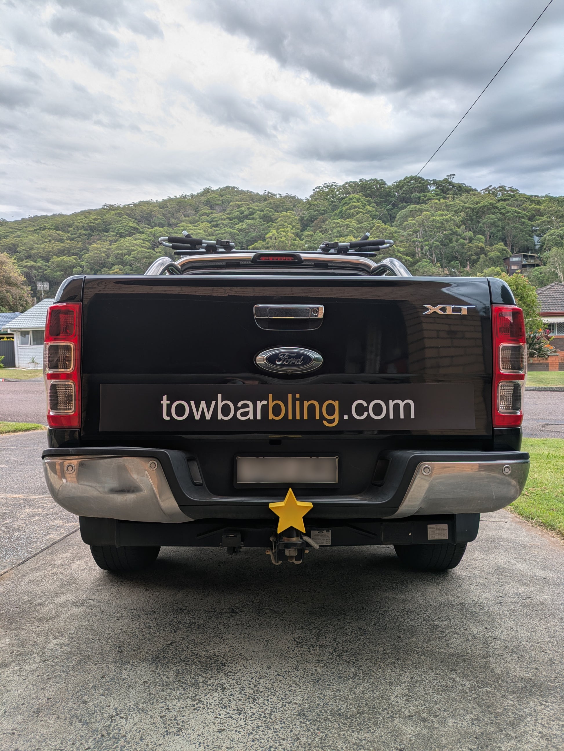 Star tow ball cover mounted on a truck tow bar
