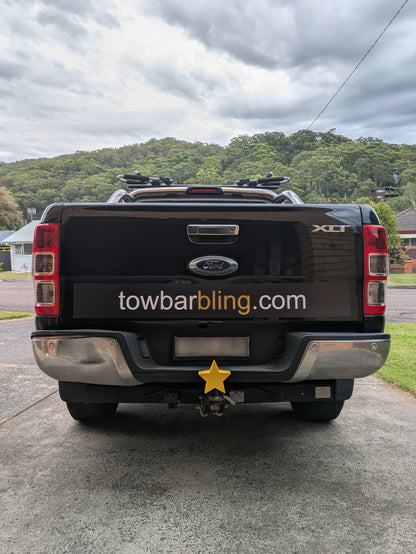 Star tow ball cover mounted on a truck tow bar