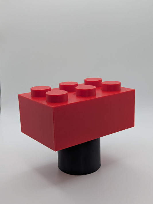 Red Toy Brick Tow Ball Cover viewed at an angle