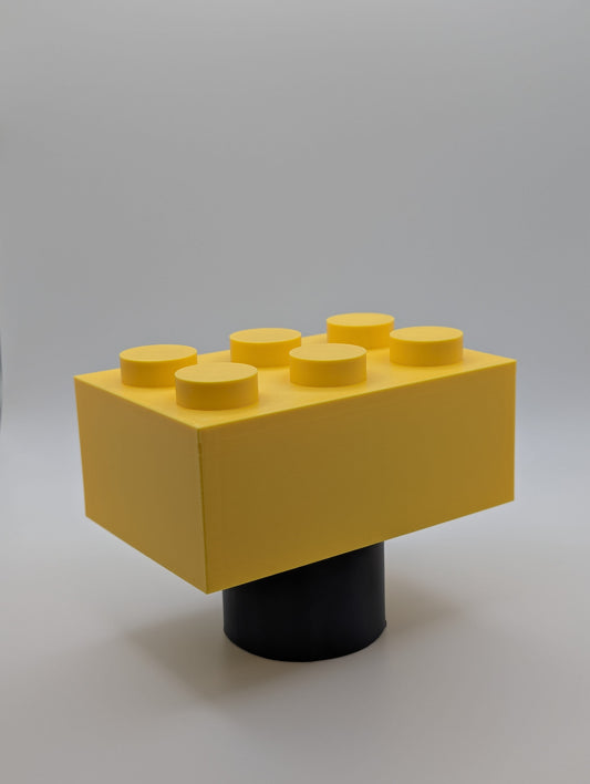 Yellow Toy Brick Tow Ball Cover viewed at an angle