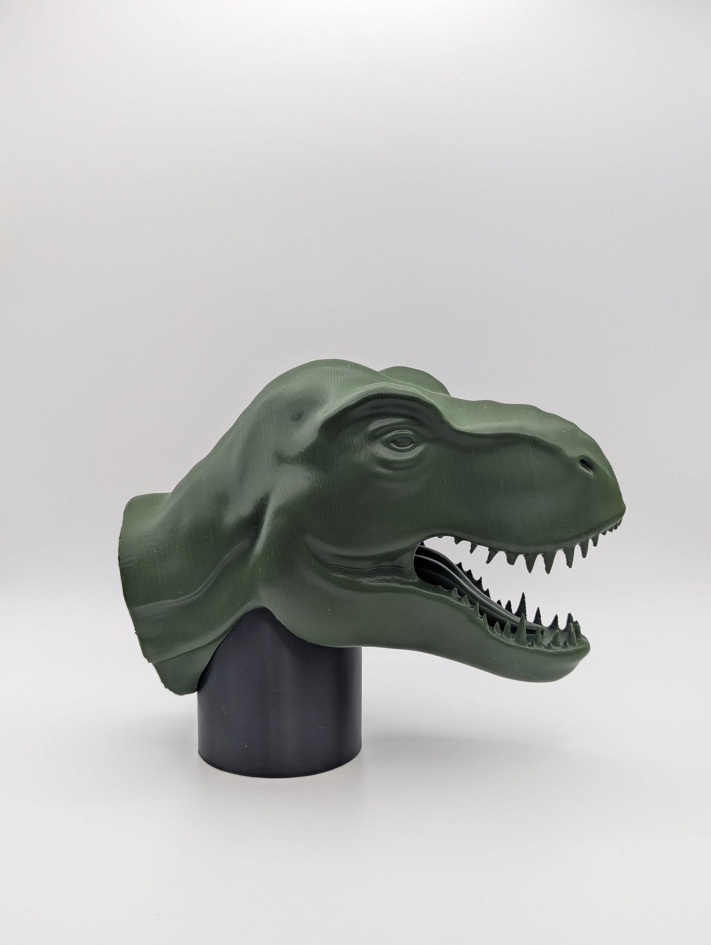 Green T-rex Dinosaur Tow Ball Cover viewed from the side